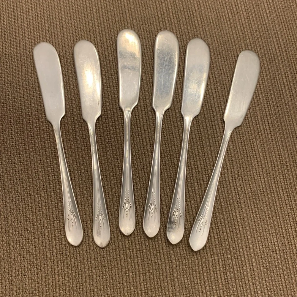 Vintage silver spreader knives